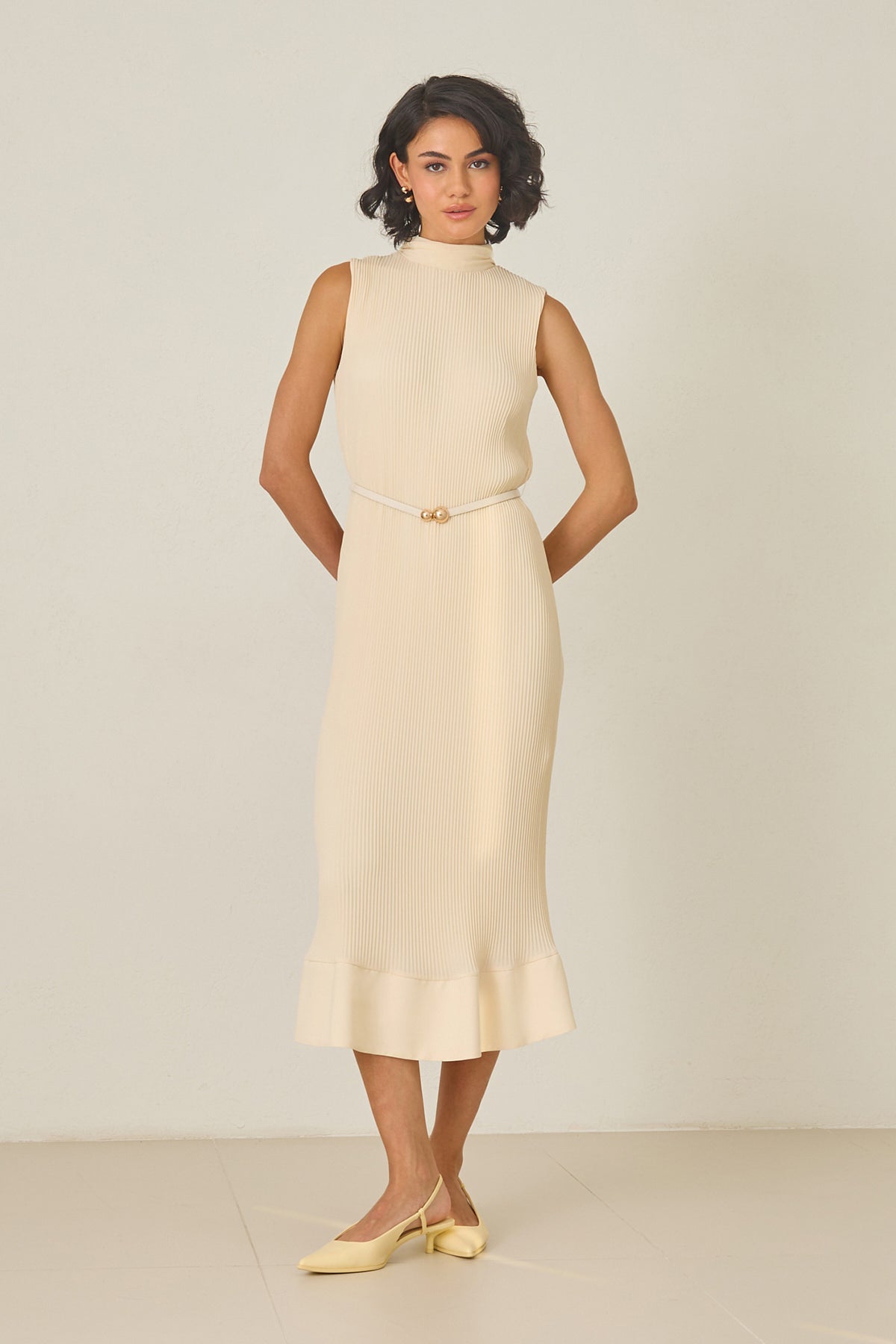 Butter yellow pleated midi dress with high neckline – sleeveless, thin belt, and ruffled hem
