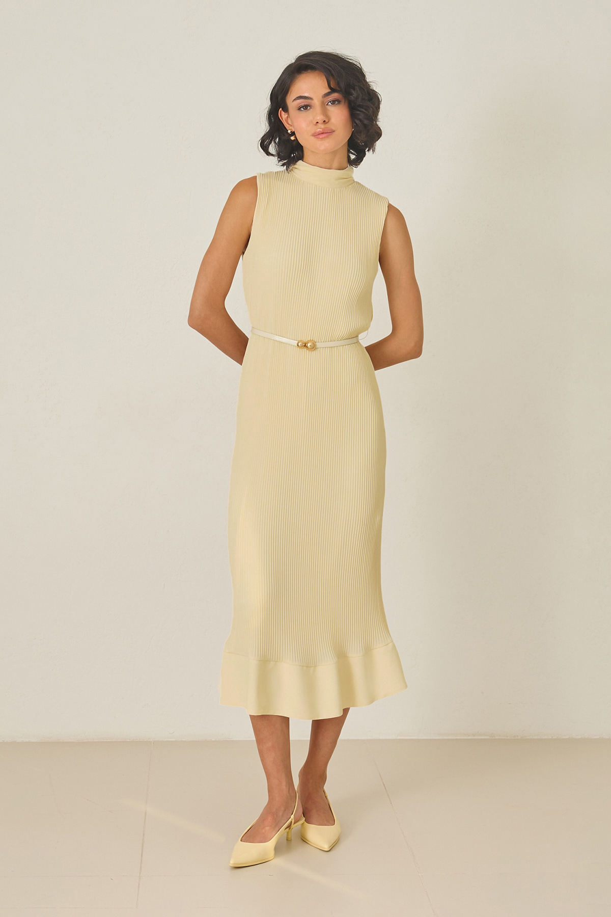 Butter yellow pleated midi dress with high neckline – sleeveless, thin belt, and ruffled hem